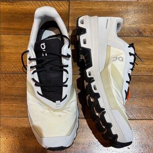 On Cloud Running Cream and Black Trail Shoes